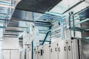 istockphoto-1072073466-612×612 Side view of the huge industrial air handling unit in the ventilation plant room
